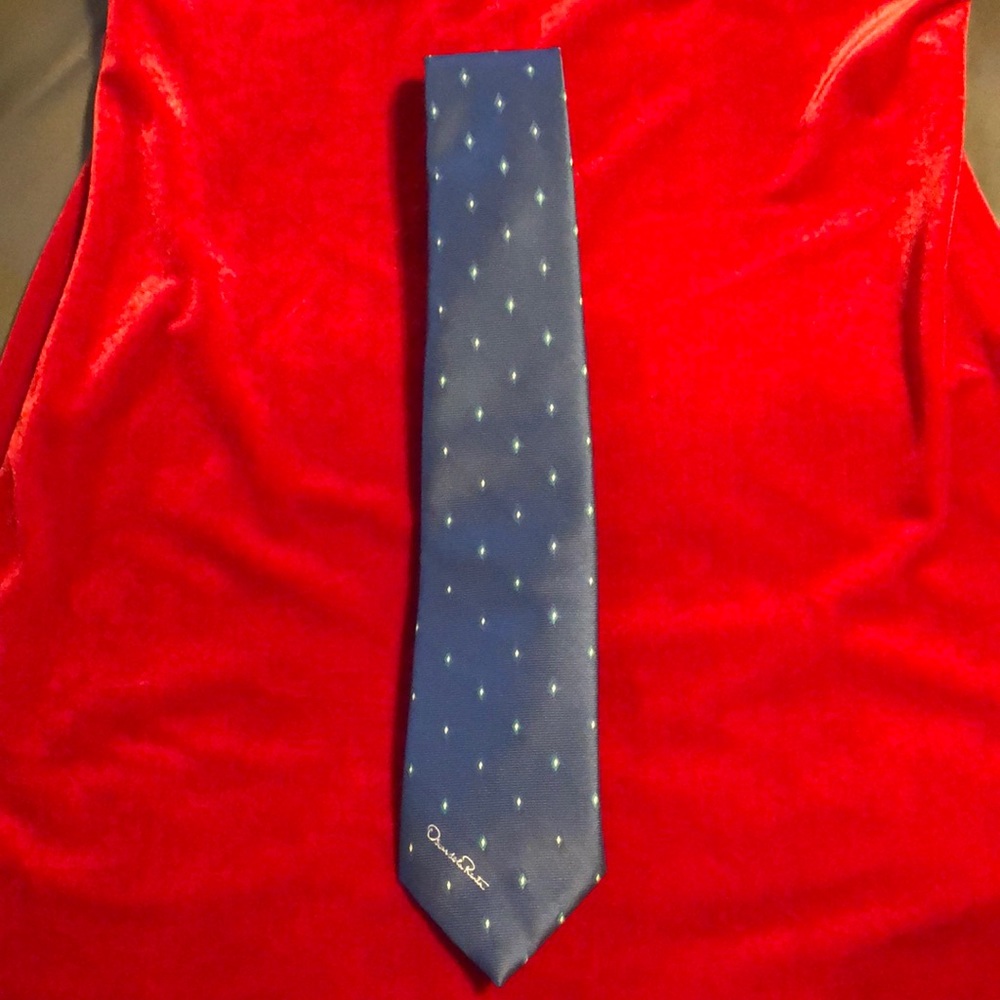 Oscar de la Renta blue tie, measures about 3” at bottom